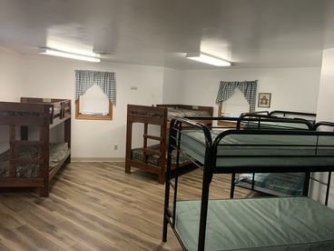 Bunk room with wood and metal beds